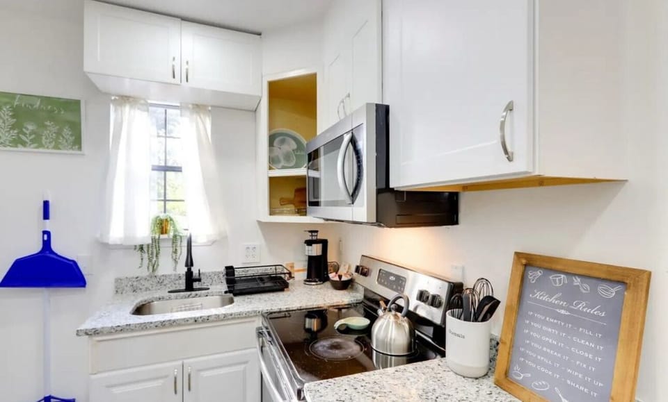 Kitchen stocked with coffee, tea and water. Coffee maker & tea kettle!