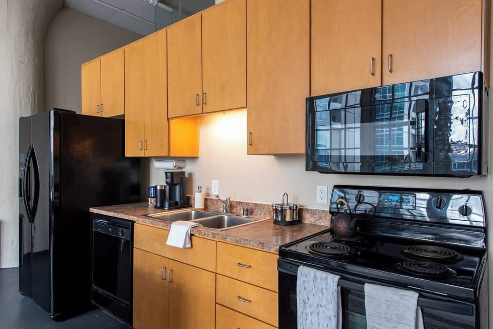 Kitchen 2 is fully stocked, including a Keurig with assorted coffee cups.  