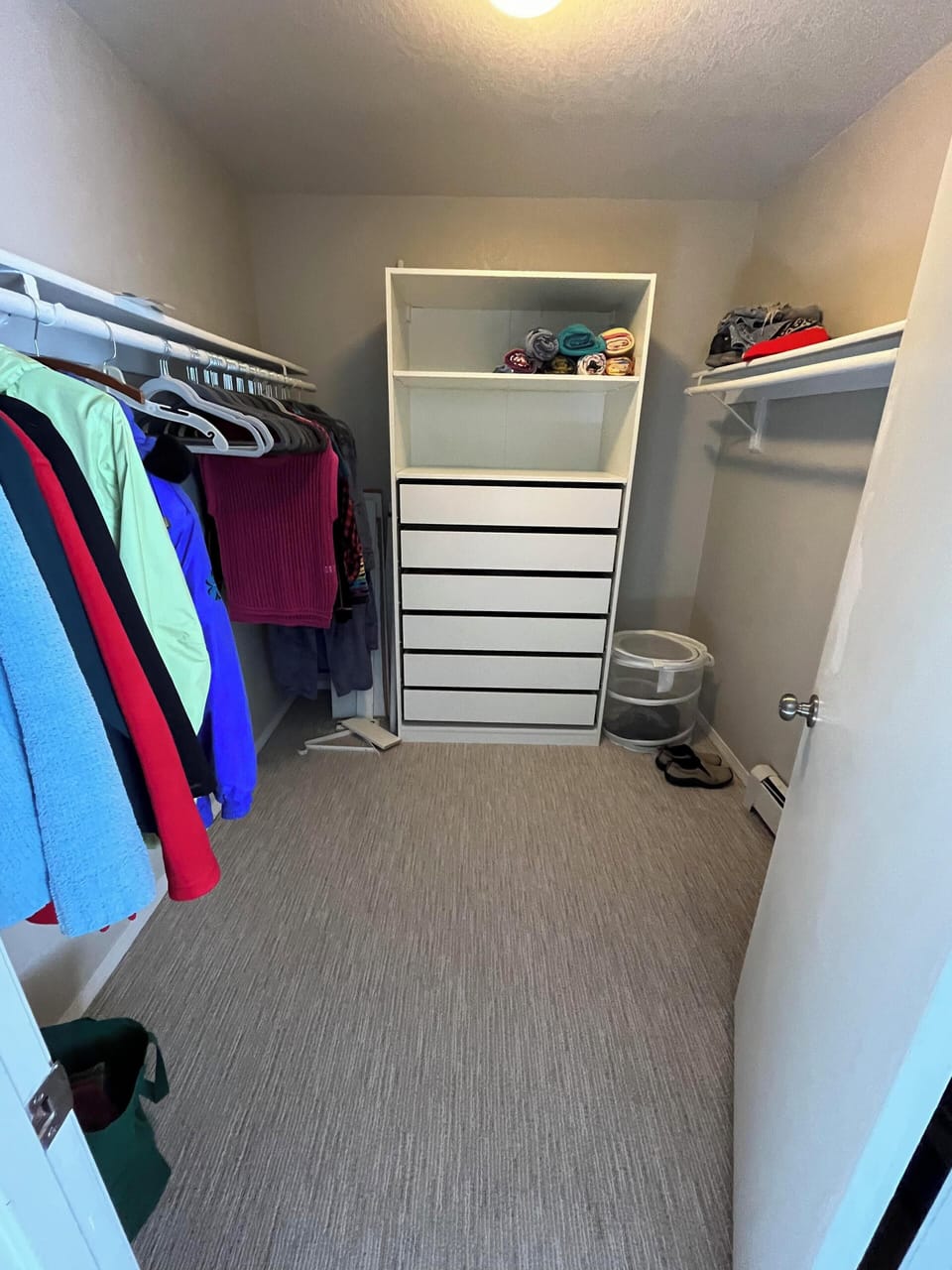 Upstairs master closet (right side now has double rods)