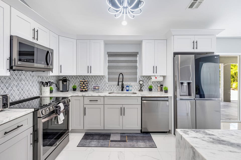 Spacious, fully stocked kitchen with smart appliances and an island