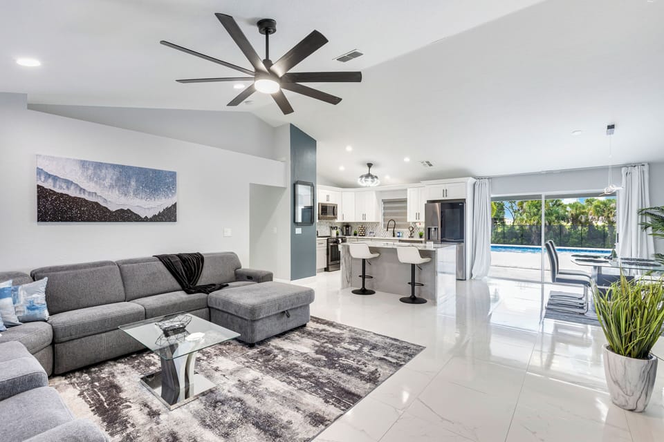 Spacious living area with designer rugs and stylish décor