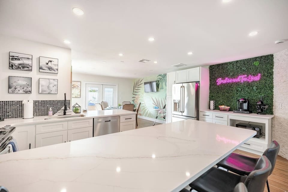 Large countertops, stainless steel appliances,  and a fully stocked coffee bar make this kitchen a great place to cook dinner, then wake up and enjoy breakfast with your family! 
