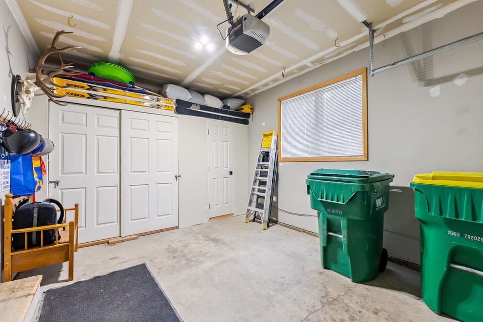 Garage: Lower floor, gear storage, trash bins, and limited parking for small vehicles