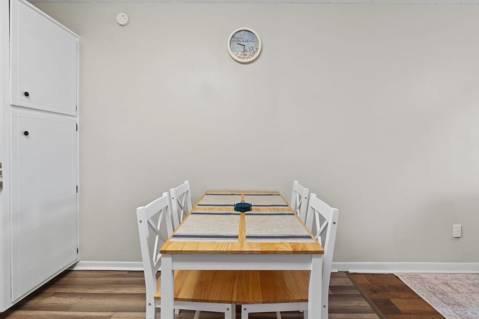 Gather around this cozy four-seat dining table — perfect for shared meals, morning coffee, or planning your next adventure.