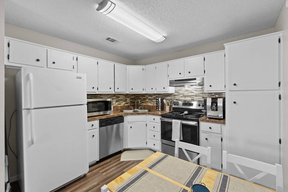 Ample counter space and a cozy dining area for those perfect dinner moments.