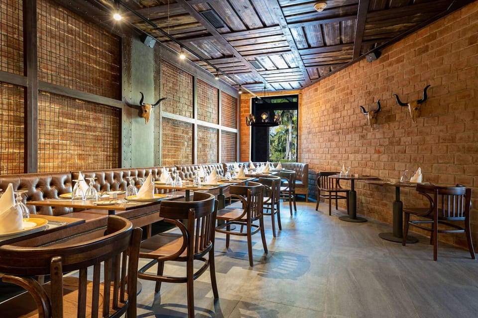 Unwind in a quieter corner with cozy booth seating.