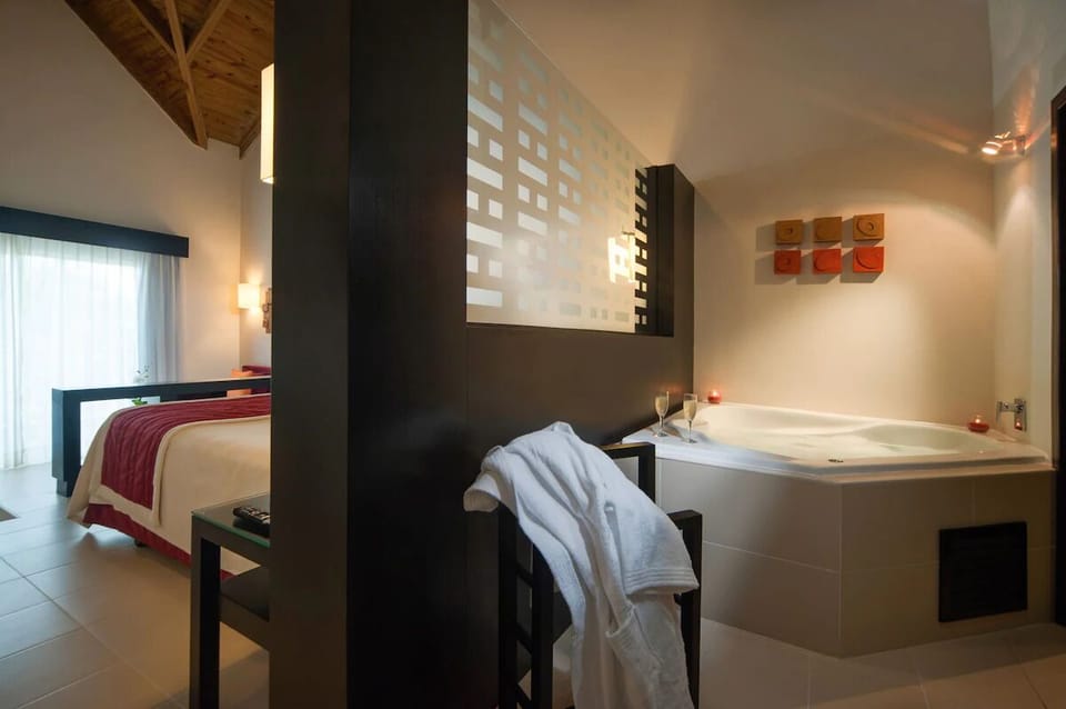 Soak in the oversized tub with candlelit, spa-like calm.