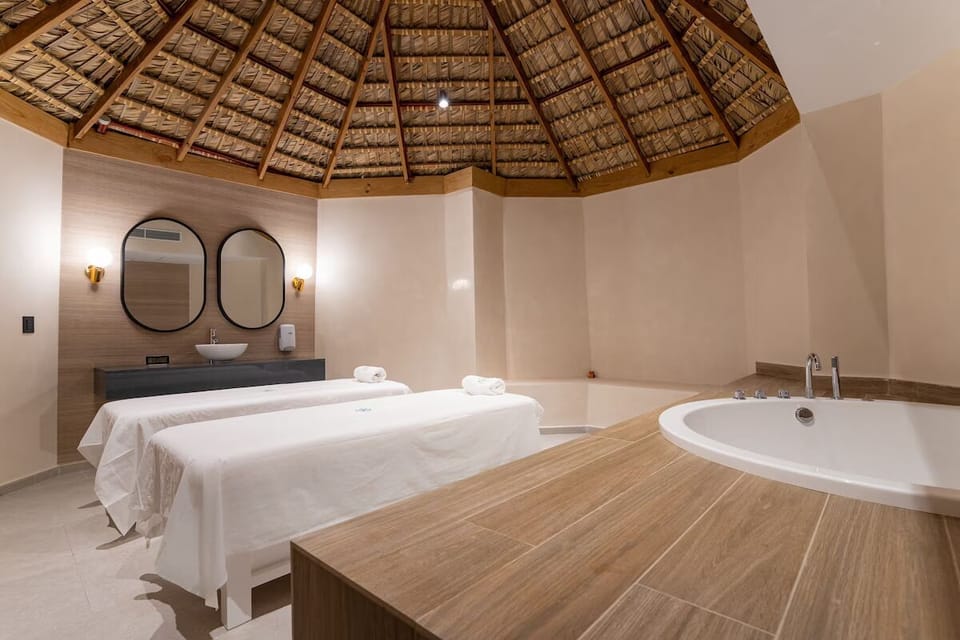 Indulge in soothing spa rituals on serene, candlelit massage beds.