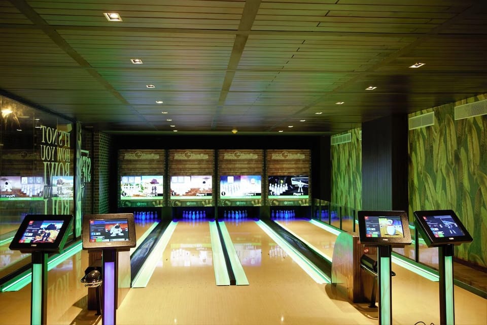 Challenge friends to a fun night on glossy bowling lanes.