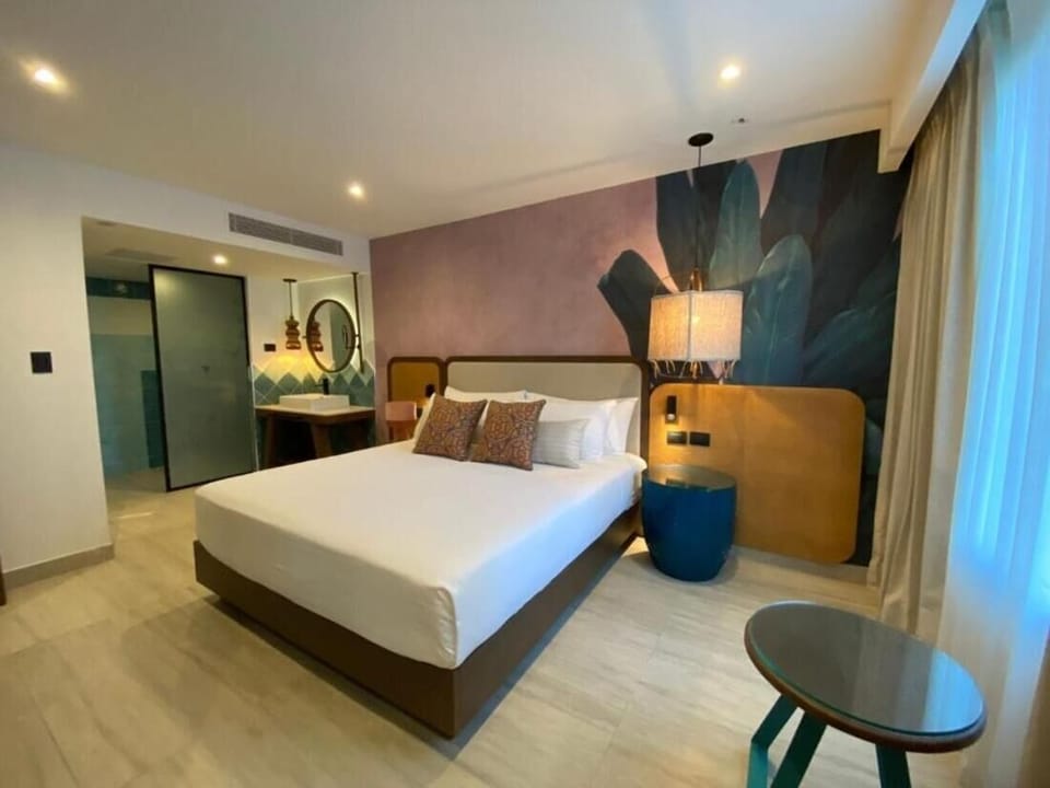 Recharge in a serene king room with soft evening lighting