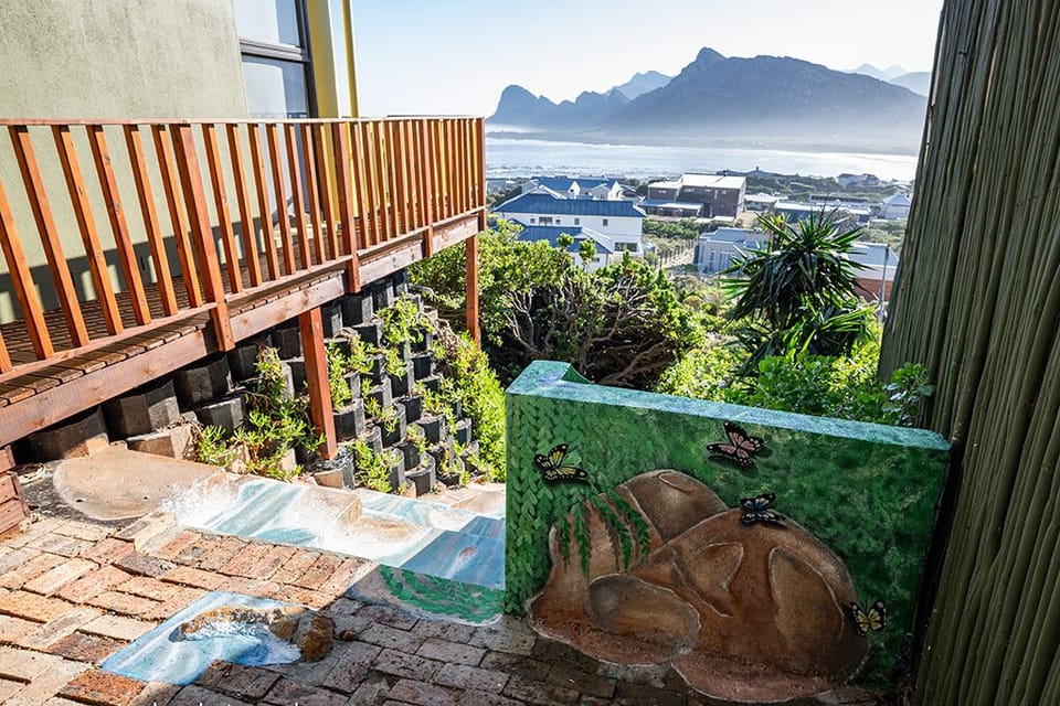 Private side-entrance onto the patio with local art