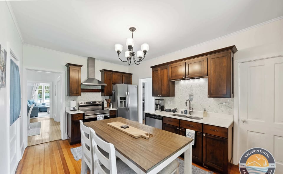 Cook and gather in the fully equipped kitchen with generous counter space and an inviting island. Ideal for prepping meals while staying connected with family and friends.