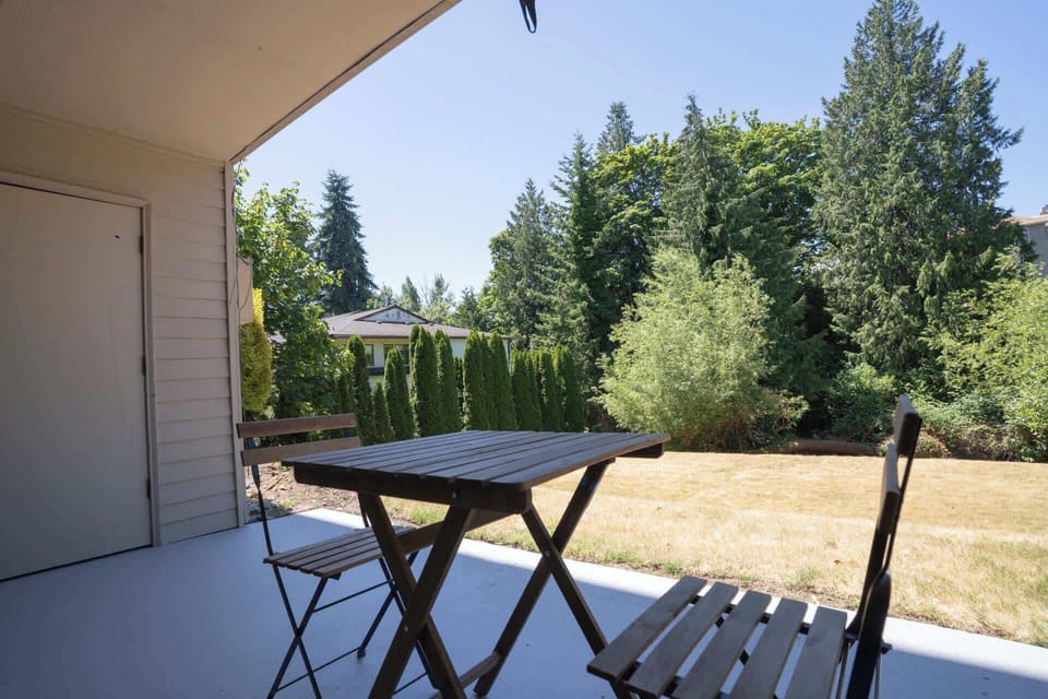 Simple and inviting deck setup, ideal for sipping coffee or sharing a quiet chat.