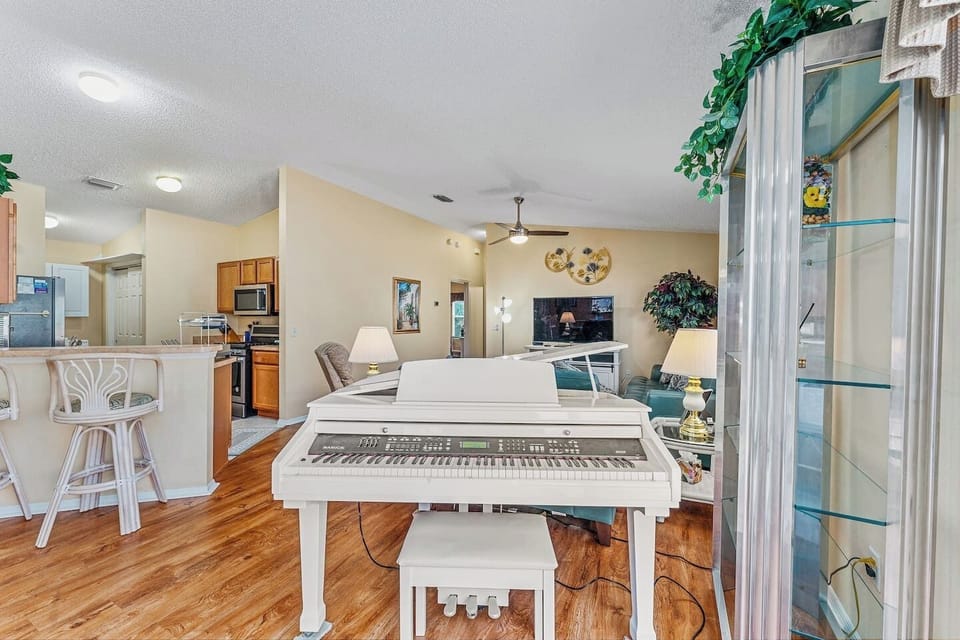 Anyone play the piano?  The beautiful baby grand is waiting to make beautiful music!