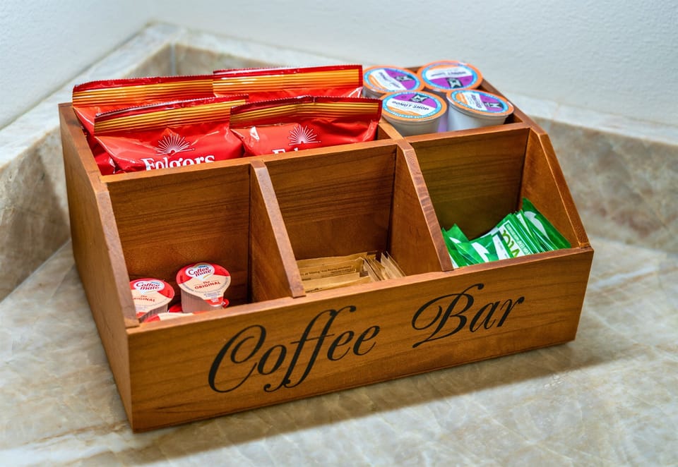 Caffeine lovers rejoice! A fully stocked coffee bar with all the fixings is ready for you.