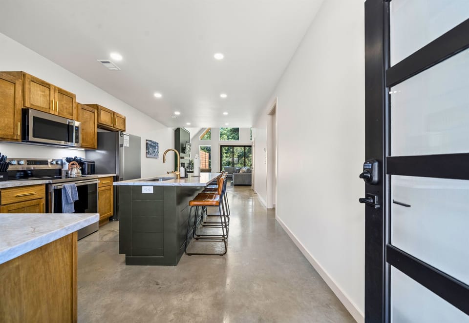 Spacious kitchen with all the tools and room you need for group dinners and morning waffles.