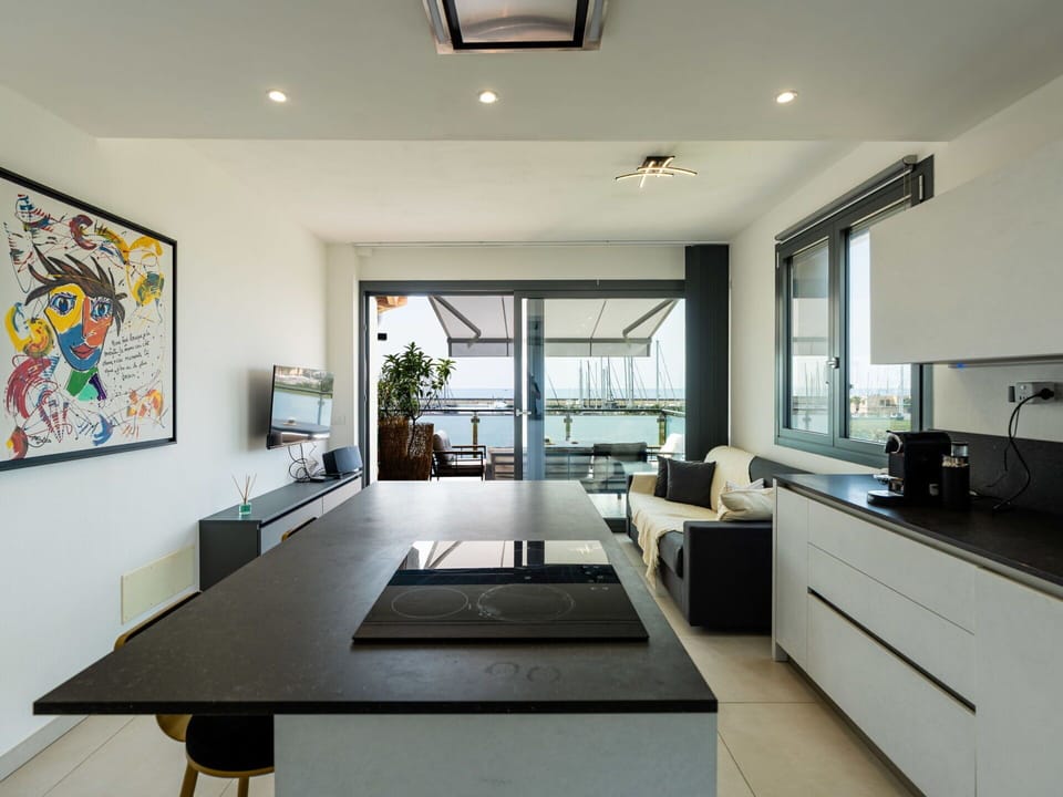 Furniture, Interior Design, Kitchen, Flooring, Countertop, Ceiling, Floor, Wood, Cabinetry, Lighting