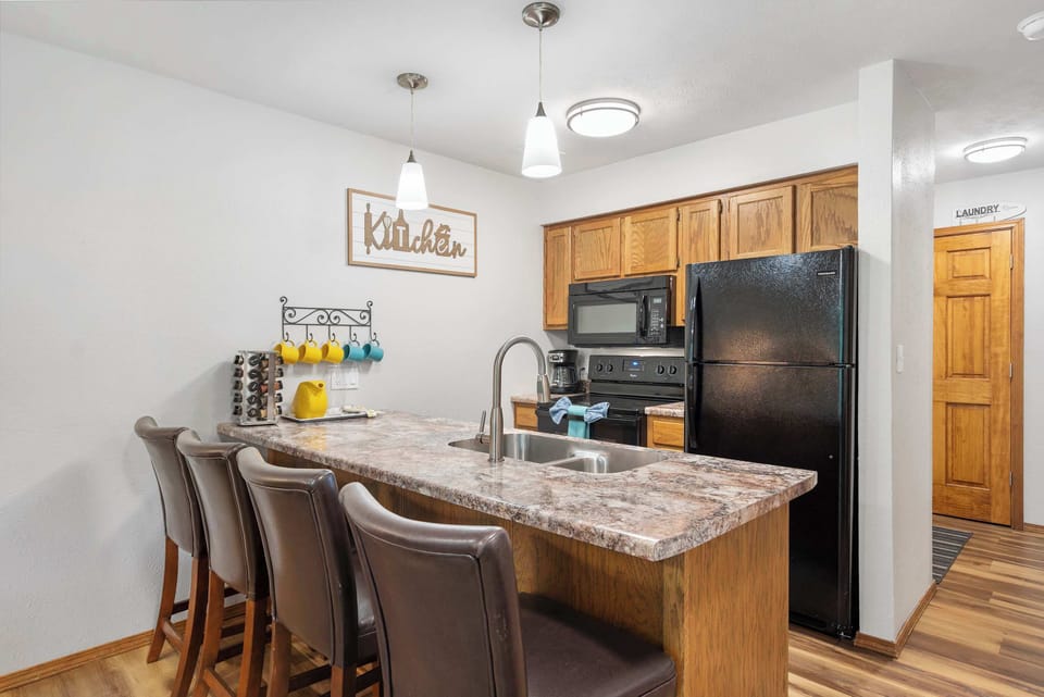 The open kitchen offers ample space & every home comfort