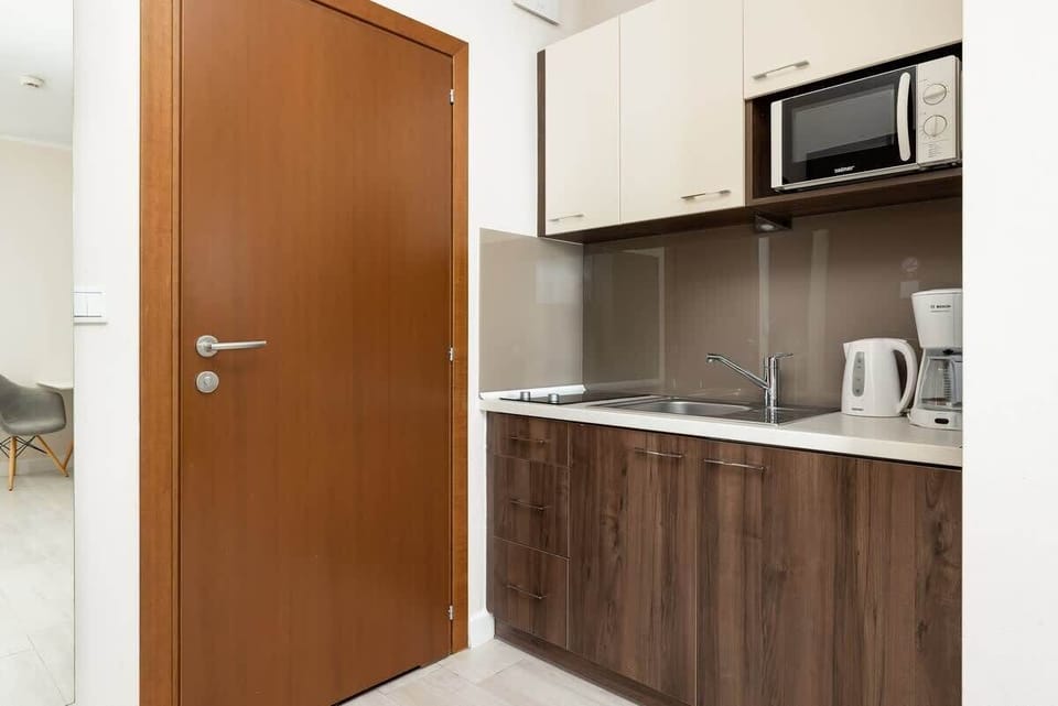 The fully equipped kitchenette includes everything you need for a home-cooked meal.