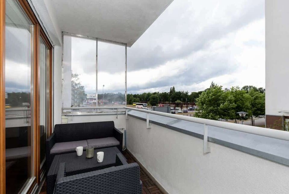 Spacious balcony with views of the surrounding area. 