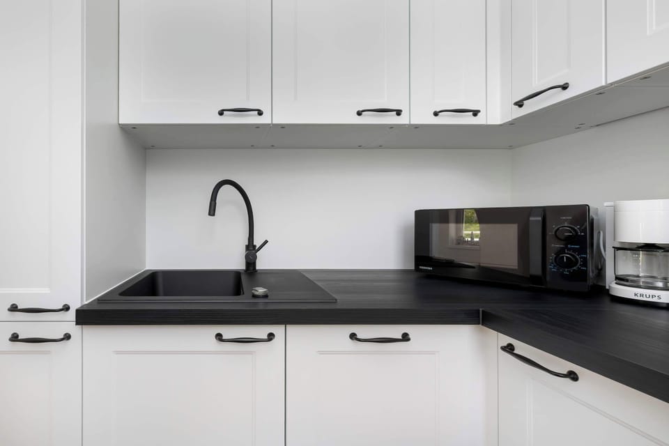 The kitchenette's practical layout maximizes space and functionality.