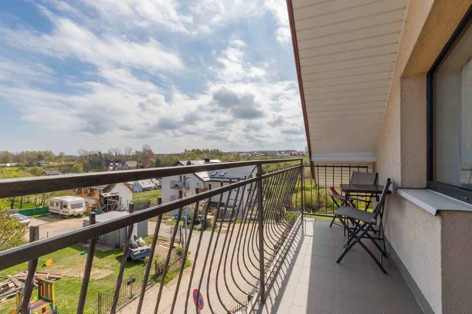 Balcony with garden furniture.