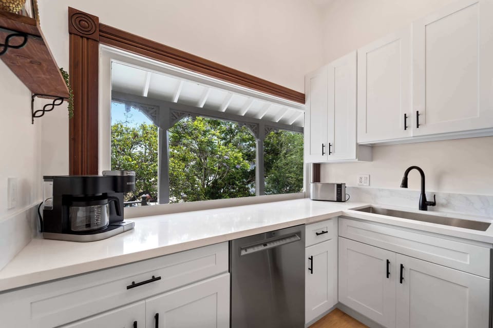 Kitchen with large window and garden views