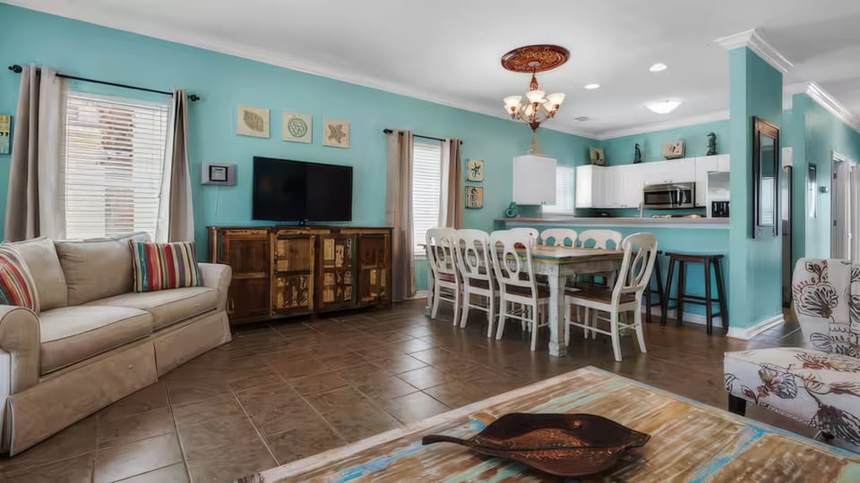 Kitchen off dining area with bar seating