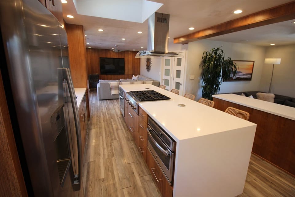 Chef’s kitchen with large island that can accommodate meal prep and socializing