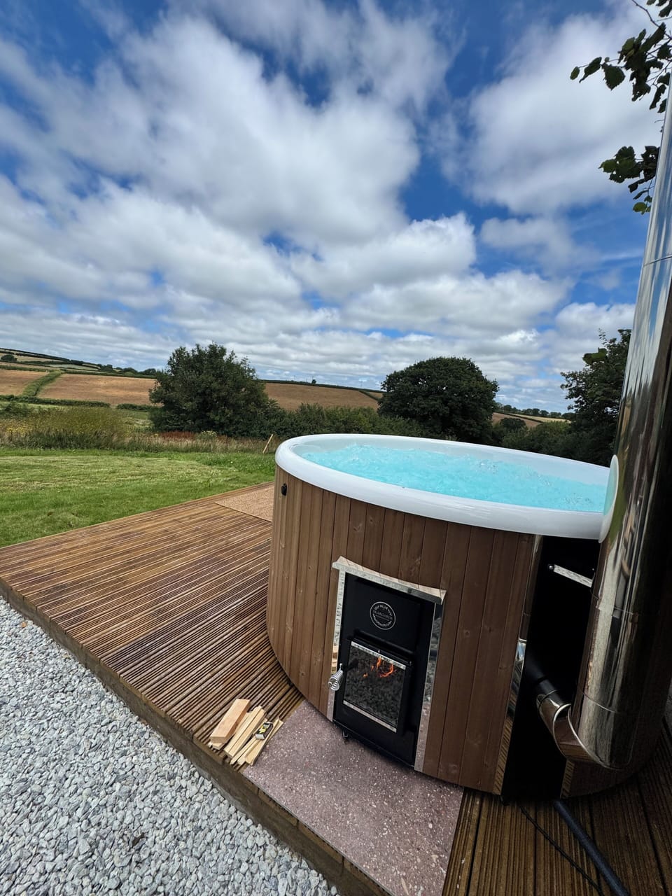 Relax in the hot tub with views of the surrounding countryside