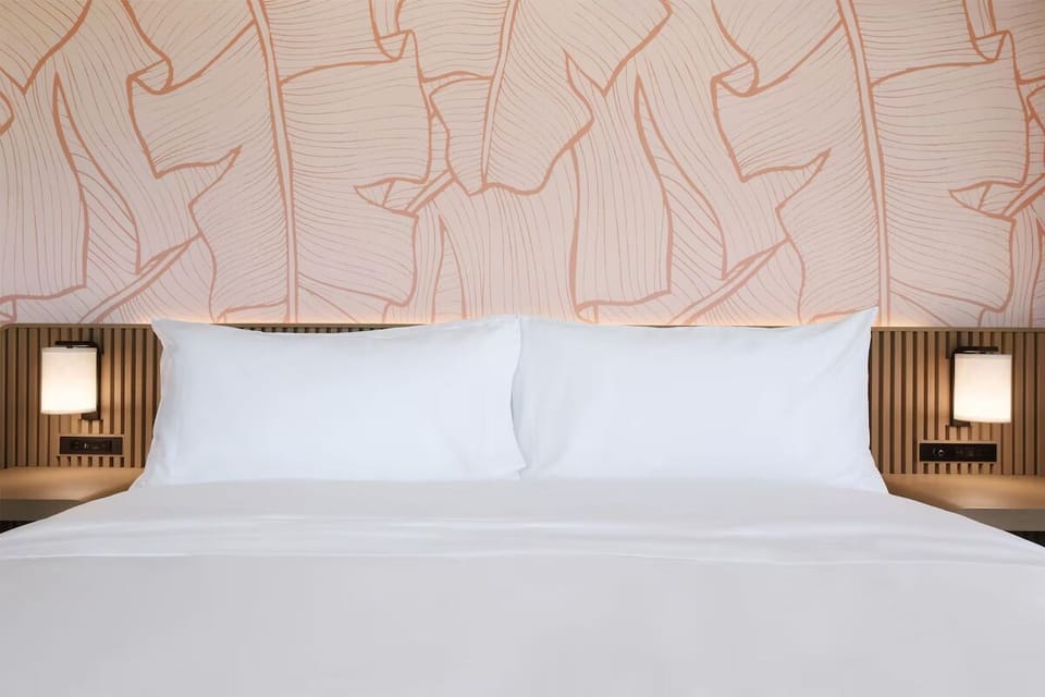 Sink into smooth sheets and enjoy soft, ambient bedside light.