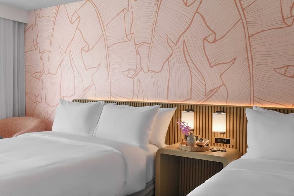 Settle into plush beds beneath warm, calming designer lighting.