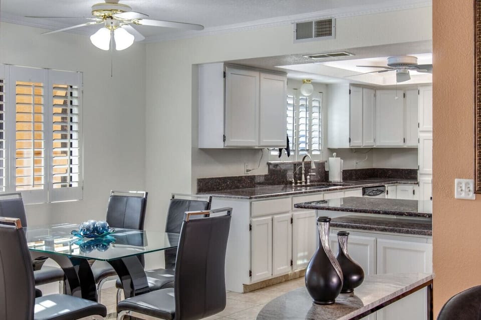 Open layout connects kitchen and dining.