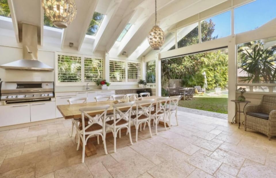 Outdoor kitchen with BBQ and dining for 14