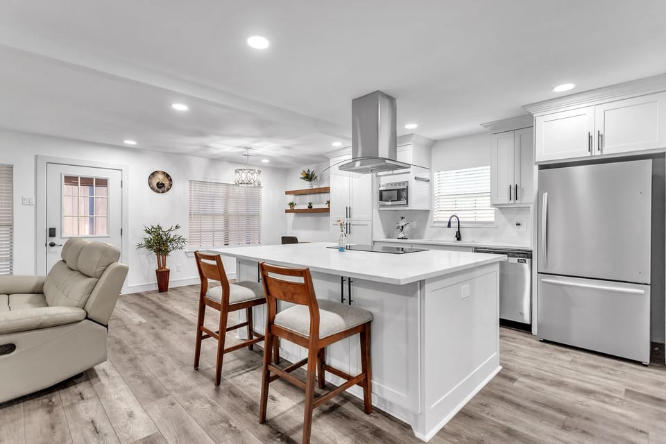 Fully equipped kitchen with full size fridge with built in ice maker.