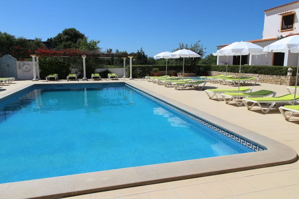 Stretch out on loungers and savor the tranquil poolside calm.