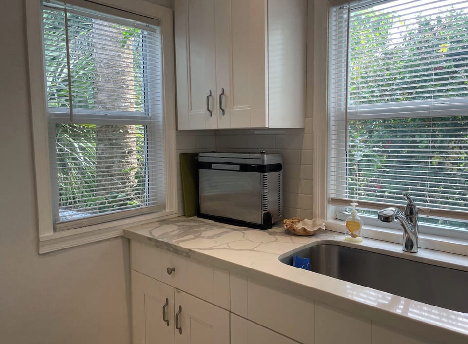 The modern, updated kitchen has all the essentials to make your meals for everyone to enjoy.