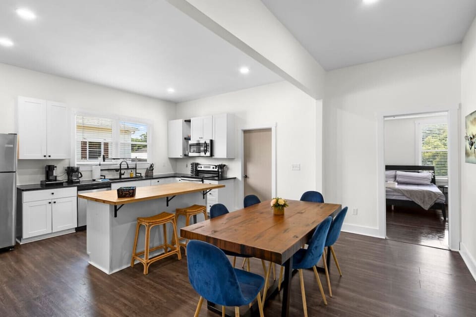 Our dining table seats 6 with an additional 2 bar seats available at our kitchen island. The perfect space to gather, share meals, and create memories with family and friends.