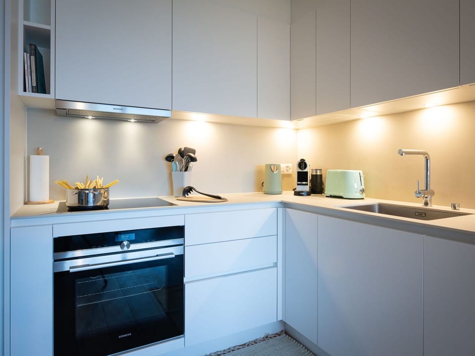 Kitchen, Kitchen Appliance, Countertop, Major Appliance, Interior Design, Cabinetry, Home Appliance, Kitchen Stove, Lighting, Light Fixture