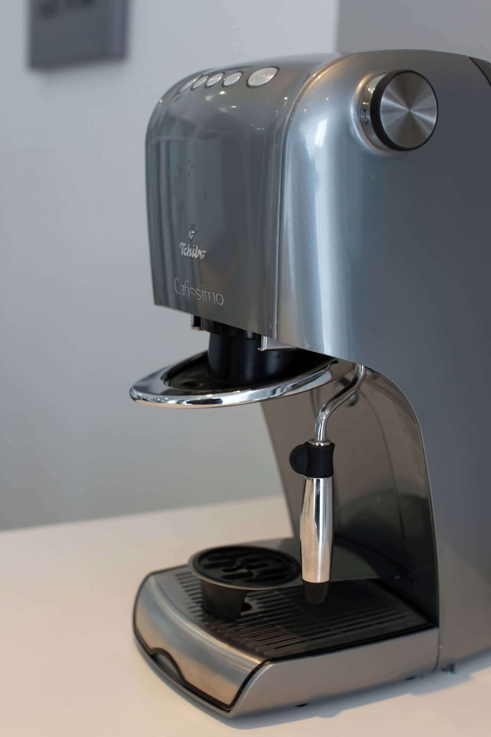 A sleek coffee machine on display, highlighting attention to small details for guests' comfort.
