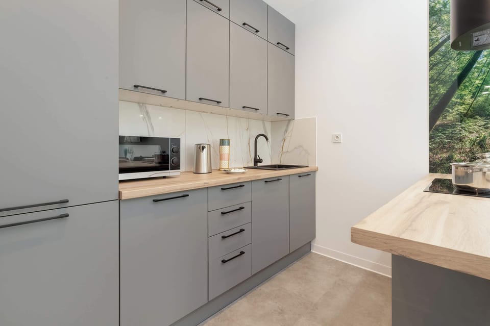 The functional kitchenette matches the rest of the room in design.