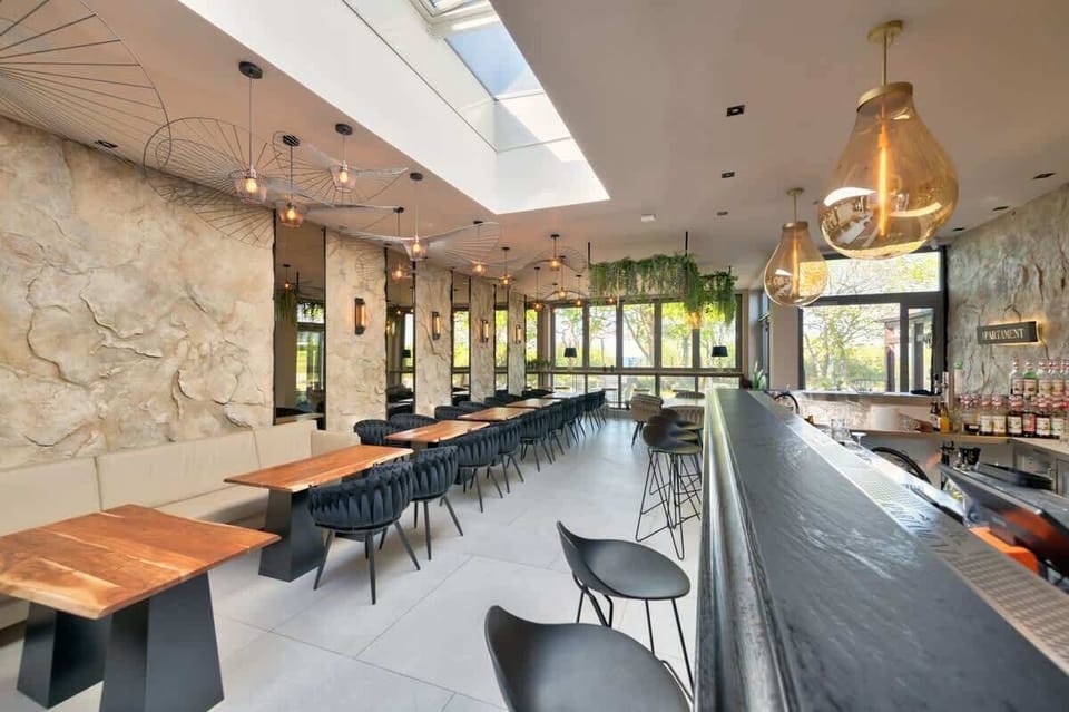 A bright restaurant space with natural light and industrial accents
