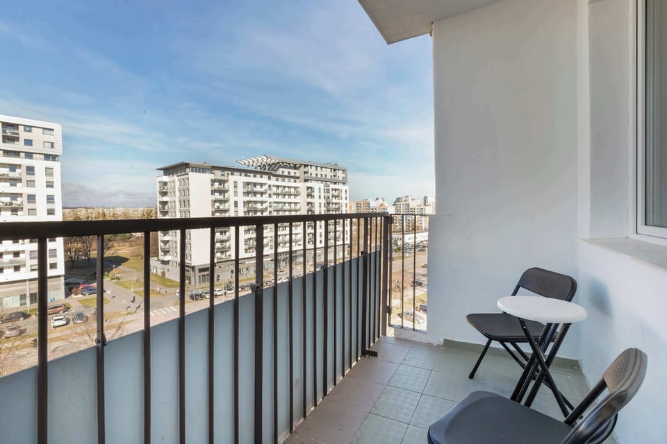 A balcony overlooking the neighborhood, offering the perfect place to relax outdoors.