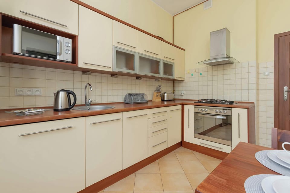 A spacious kitchen with a dining area makes mealtimes comfortable and convenient.