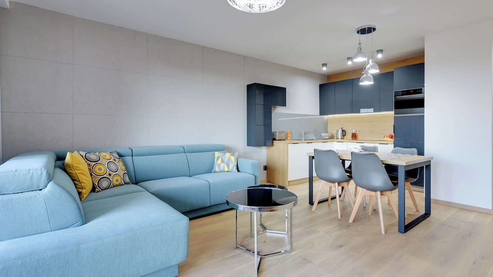 Another perspective of the living area, highlighting the open-plan layout and the light, airy atmosphere.