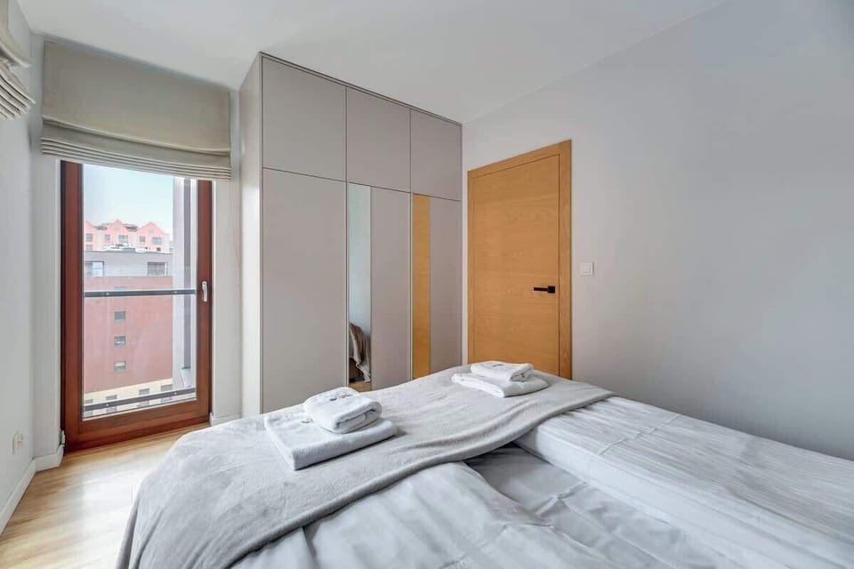 Unadorned design with neutral tones, clean lines, and contemporary furnishings, creating a calm and stylish retreat.