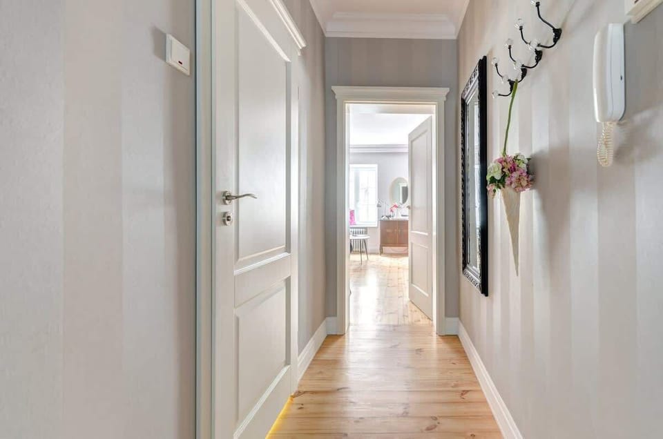 The corridor serves as a welcoming entryway to the apartment, connecting all the main living areas.