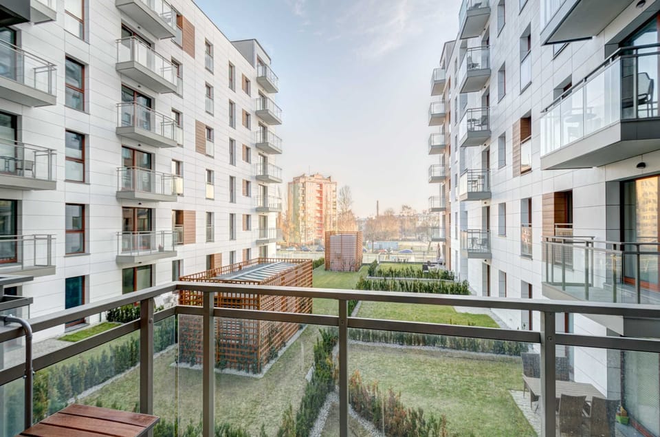 The balcony's stylish design complements the apartment's decor. 
