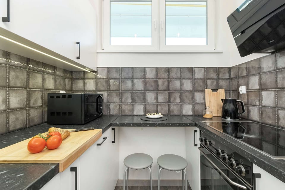 Kitchen with full equipment, necessary for daily cooking.