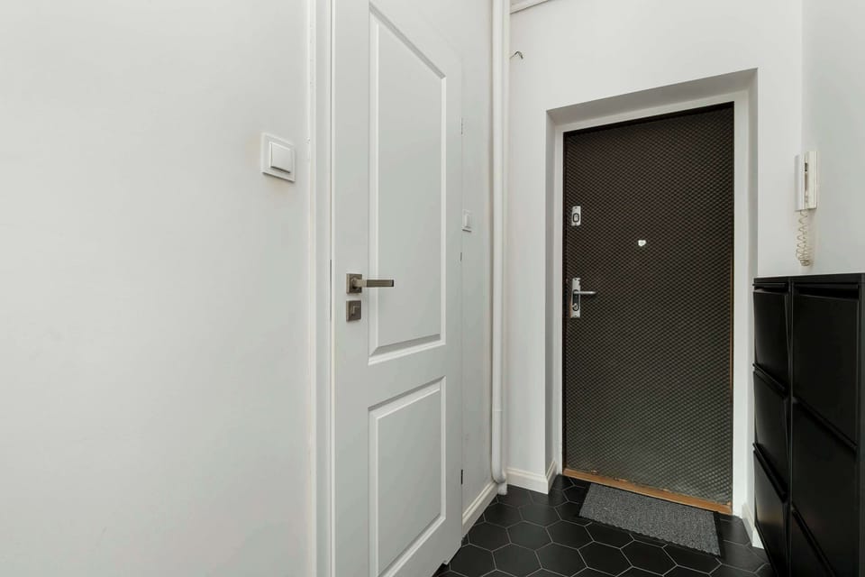 The bright entryway with clean lines gives a sense of space and order from the first step.